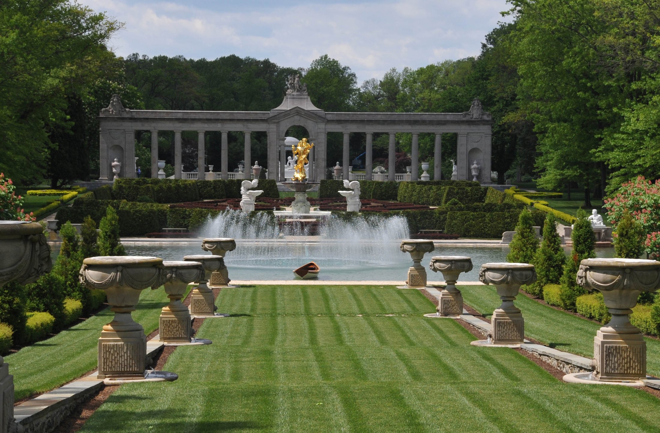 Grand estate gardens with reflecting pool and fountain